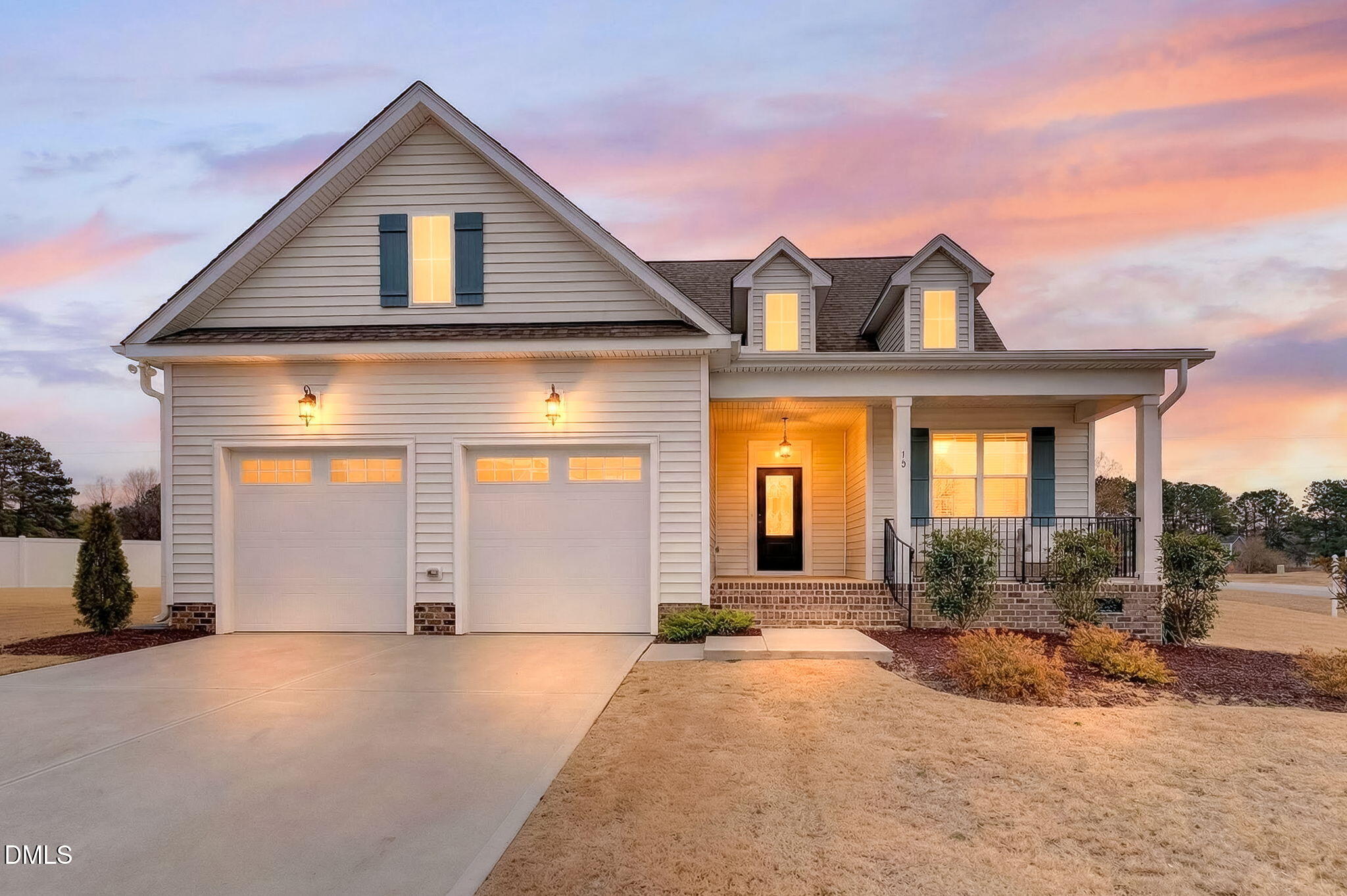 18 North Bream Court Angier, NC 27501 - Photo 2 of 49 a view of a house with large windows and a small yard