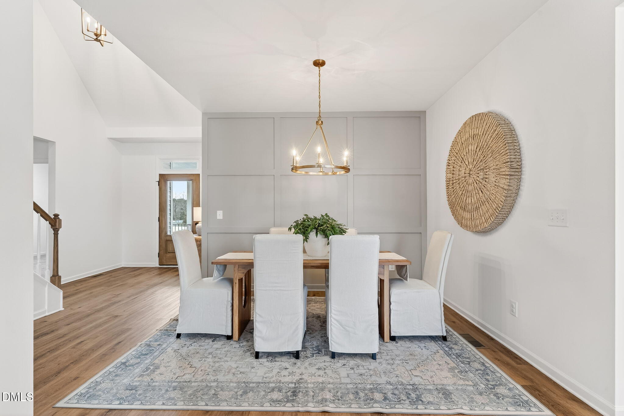 18 North Bream Court Angier, NC 27501 - Photo 3 of 49 a view of a dining room with furniture a chandelier and wooden floor