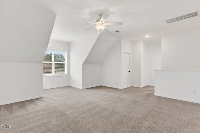 a view of a backyard of a house with a street