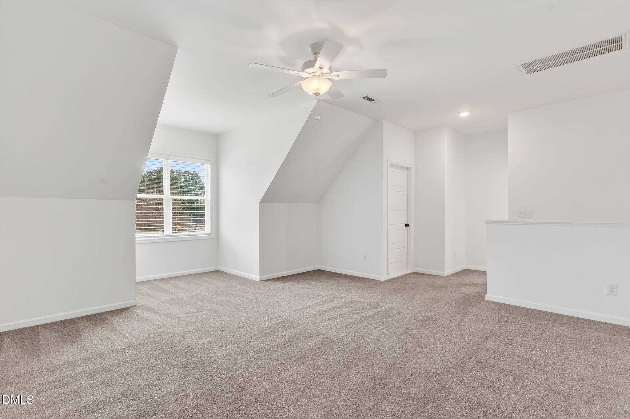 18 North Bream Court Angier, NC 27501 - Photo 35 of 49 an empty room with chandelier fan and windows