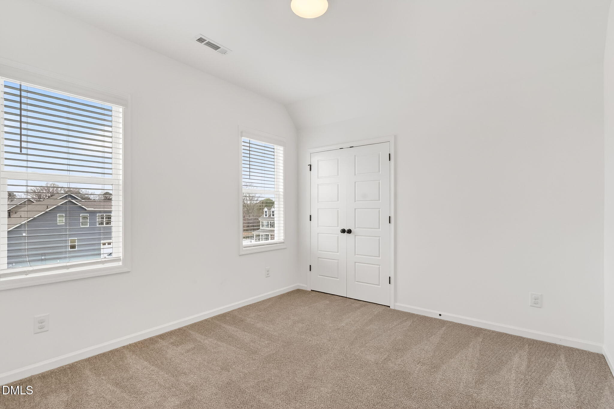 18 North Bream Court Angier, NC 27501 - Photo 39 of 49 an empty room with windows and a ceiling fan