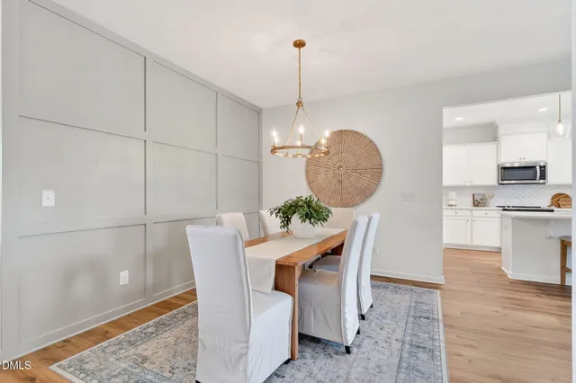 a view of kitchen with furniture and wooden floor
