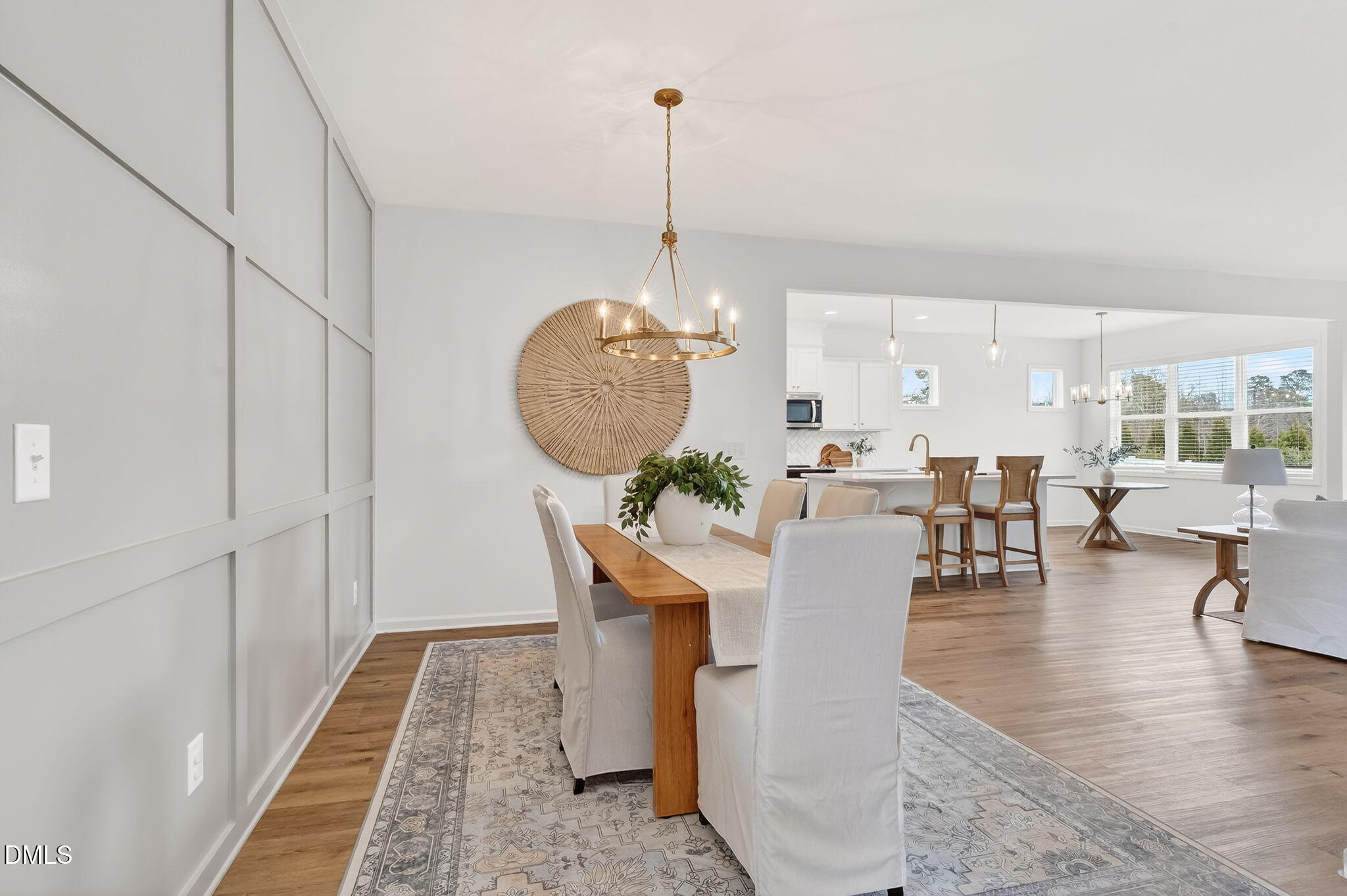 18 North Bream Court Angier, NC 27501 - Photo 5 of 49 a living room with couches a dining table and chairs with wooden floor