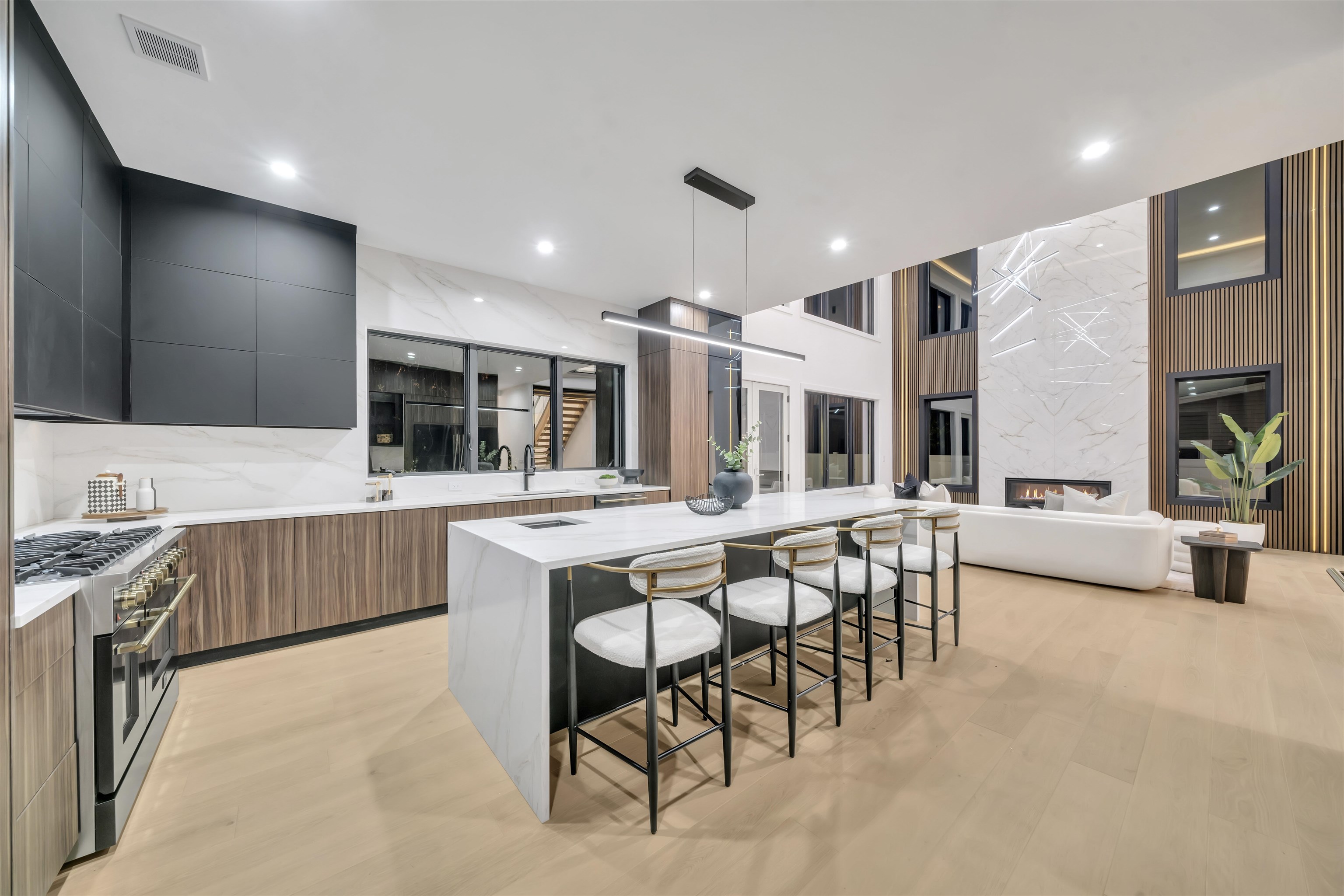 801 Godwin Road Paramus, NJ 07652 - Photo 19 of 50 a kitchen with stainless steel appliances kitchen island granite countertop a table and chairs