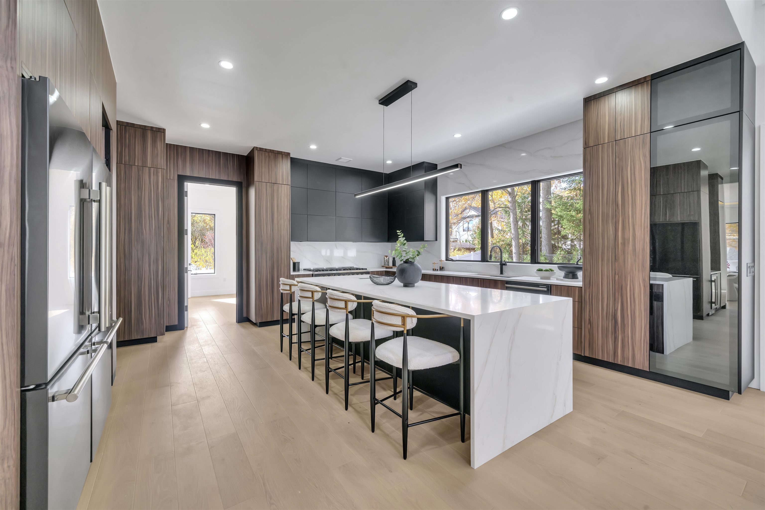 801 Godwin Road Paramus, NJ 07652 - Photo 22 of 50 a kitchen with stainless steel appliances kitchen island granite countertop a refrigerator and a stove top oven