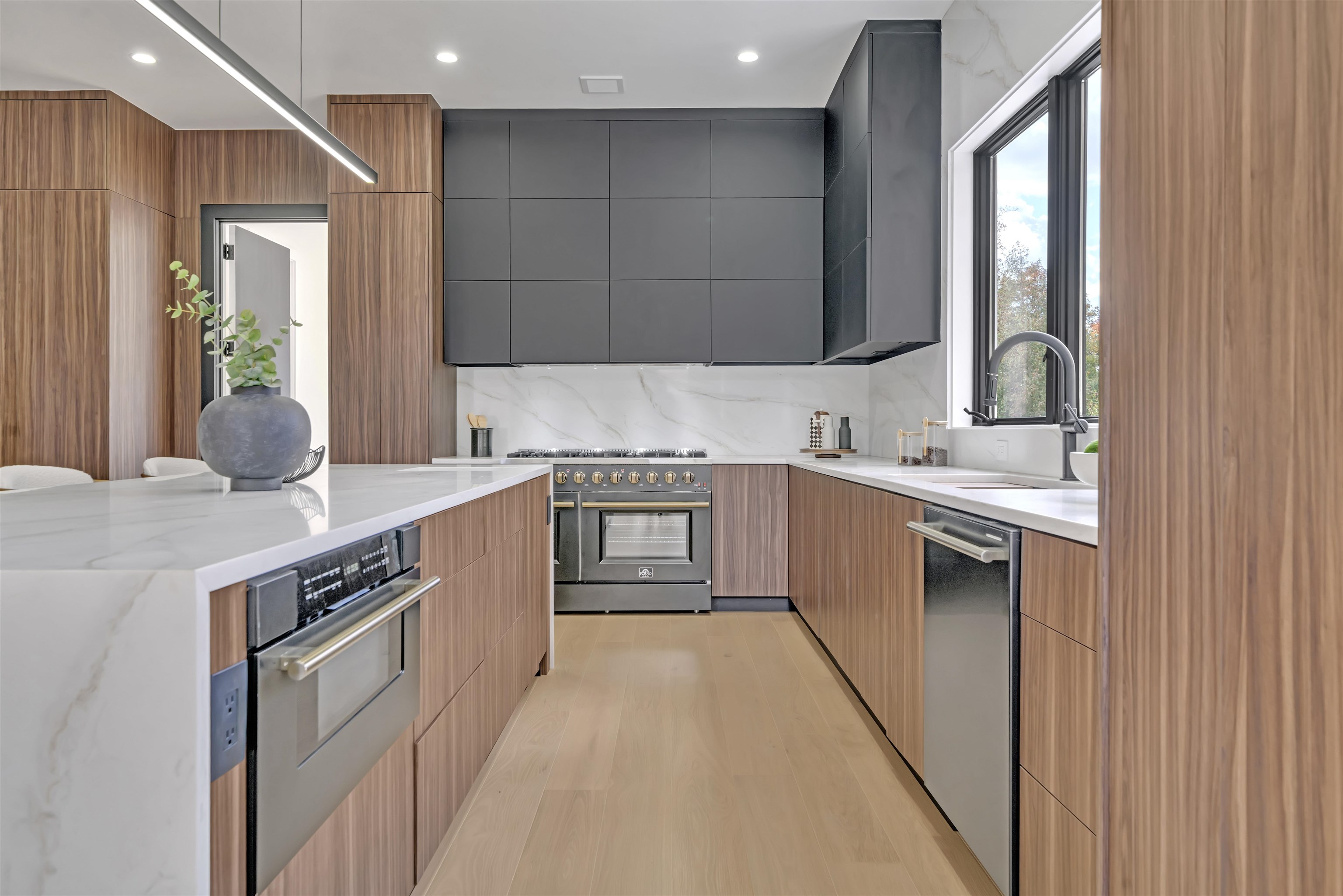 801 Godwin Road Paramus, NJ 07652 - Photo 28 of 50 a kitchen with stainless steel appliances granite countertop a sink a stove and a refrigerator