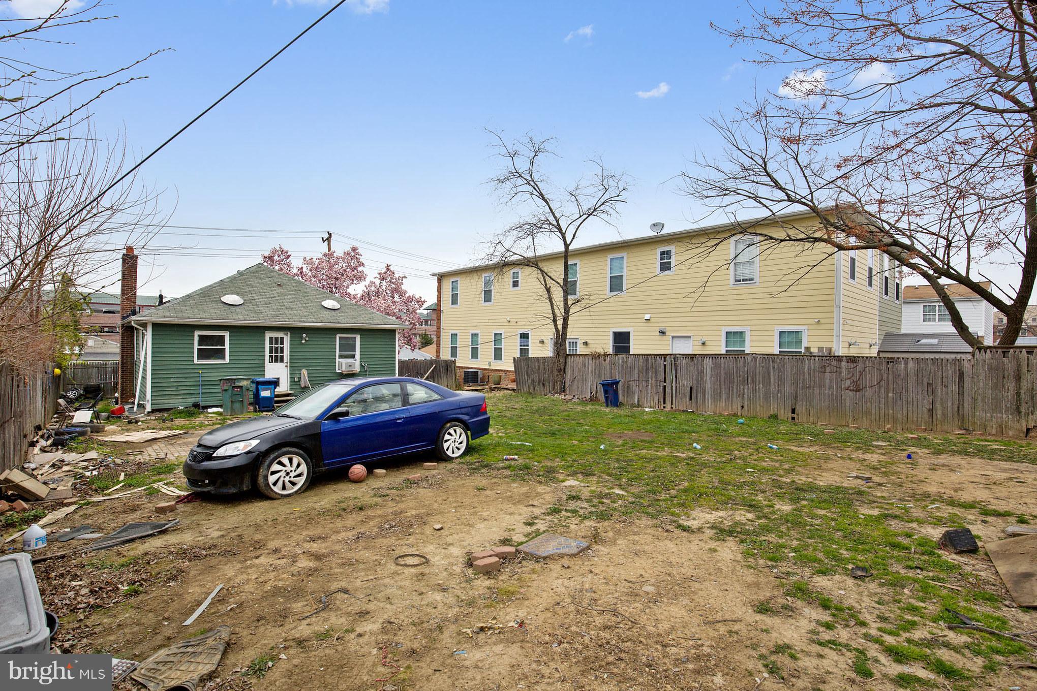 41 East Reed Avenue Alexandria, VA 22305 - Photo 10 of 30 a front view of a house with a garden and parking space
