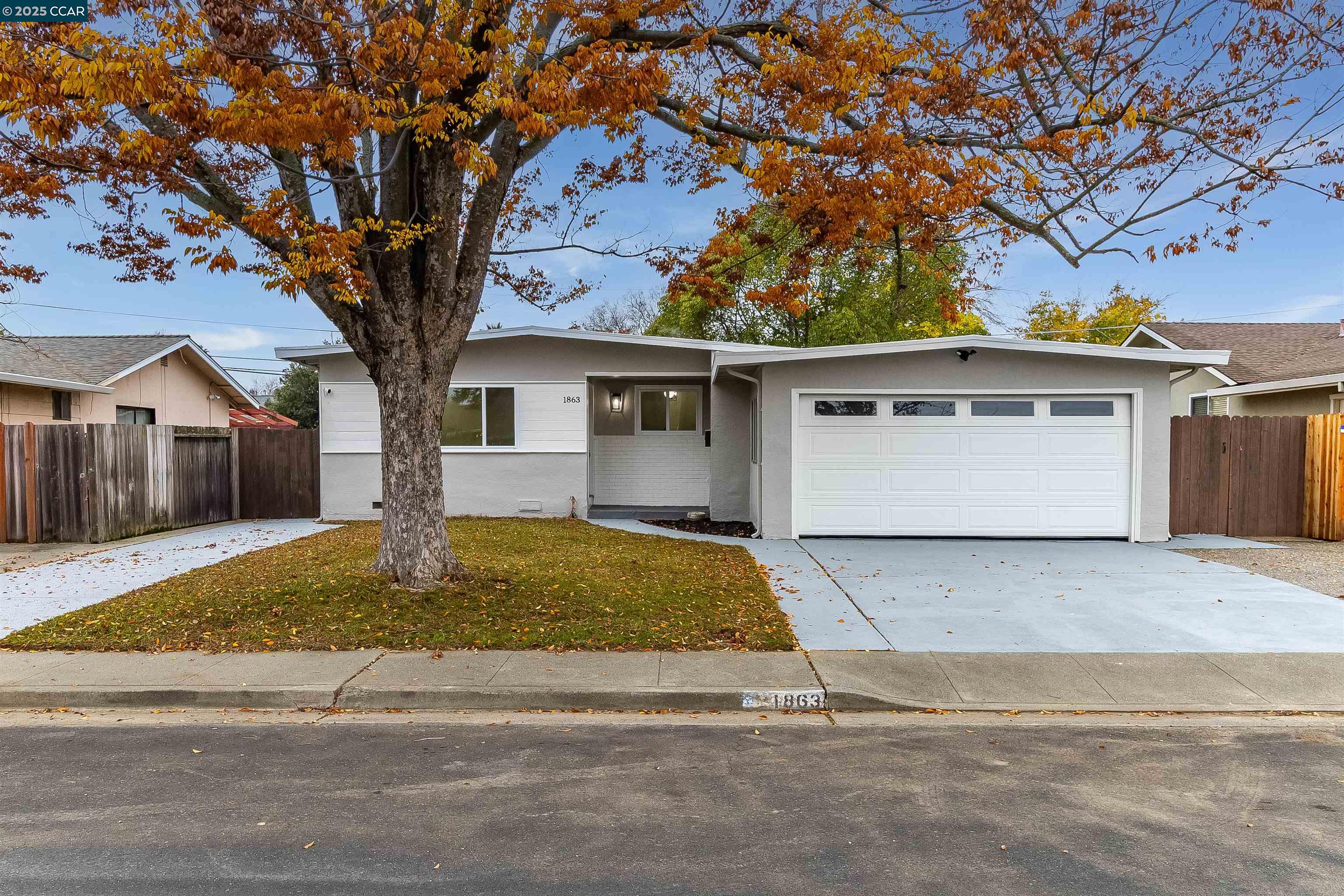 a front view of a house with garage