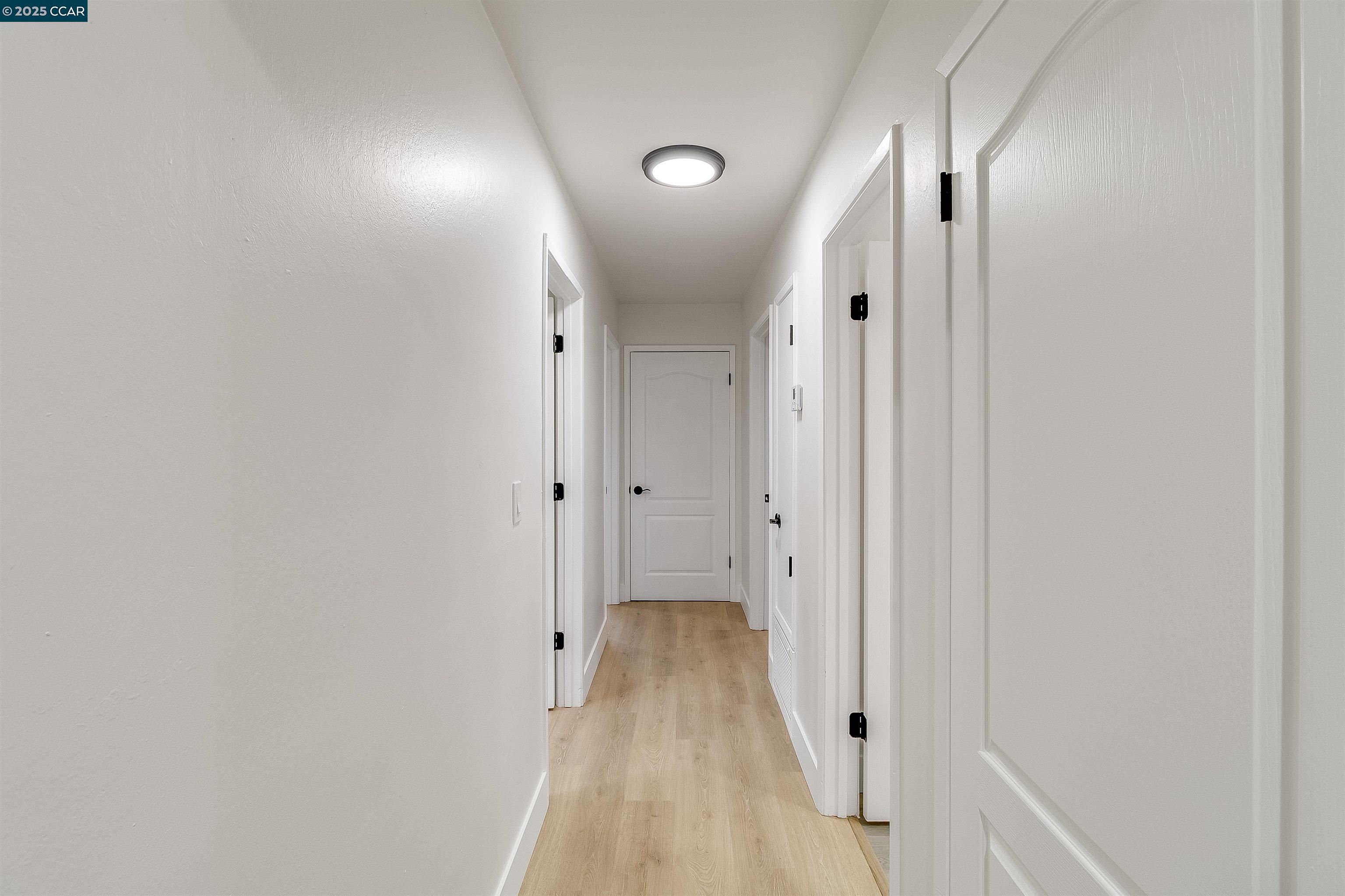 1863 San Clemente Street Fairfield, CA 94533 - Photo 17 of 29 a view of a hallway with wooden floor and a hallway