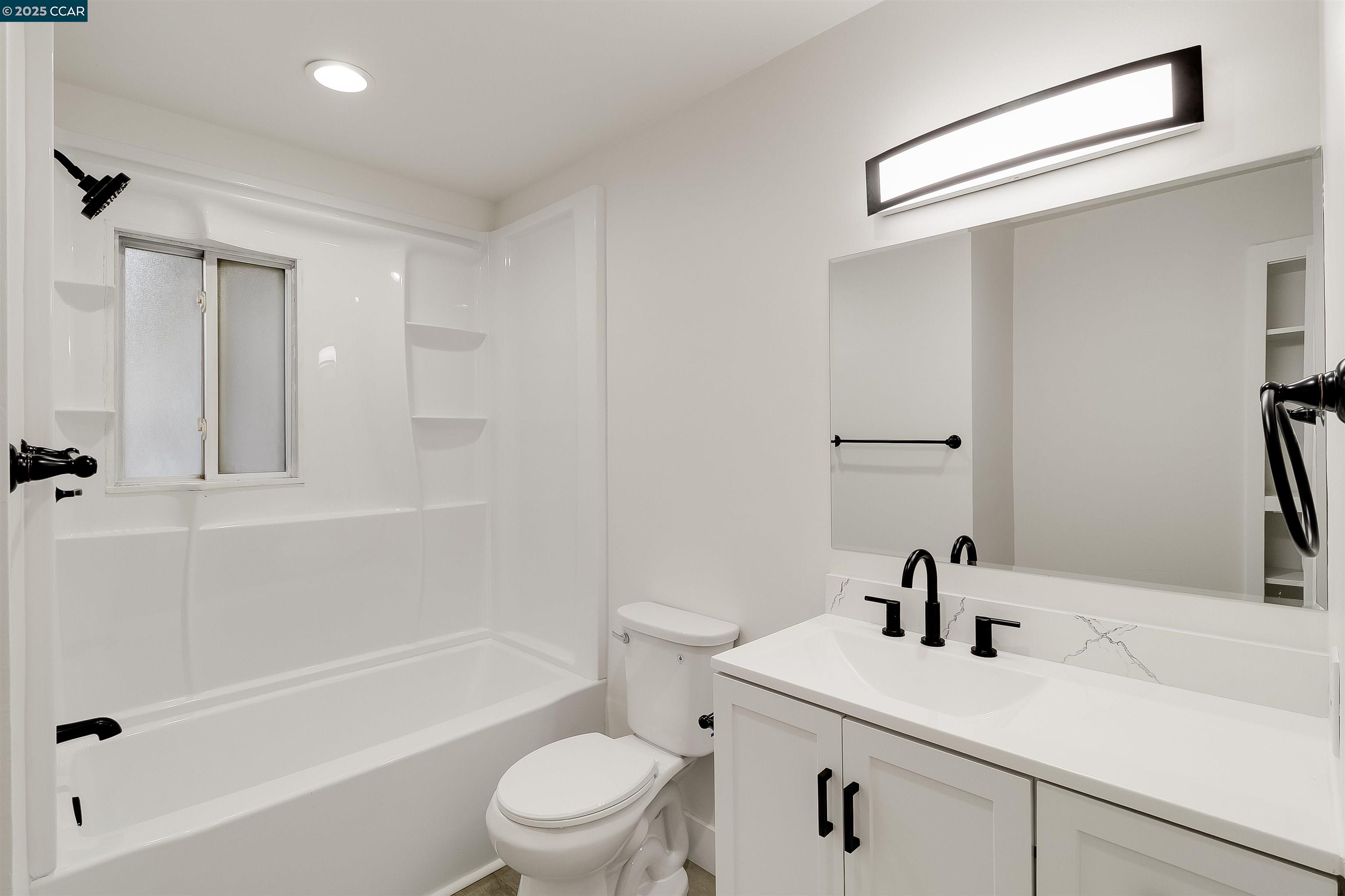 1863 San Clemente Street Fairfield, CA 94533 - Photo 18 of 29 a bathroom with a sink a toilet and shower