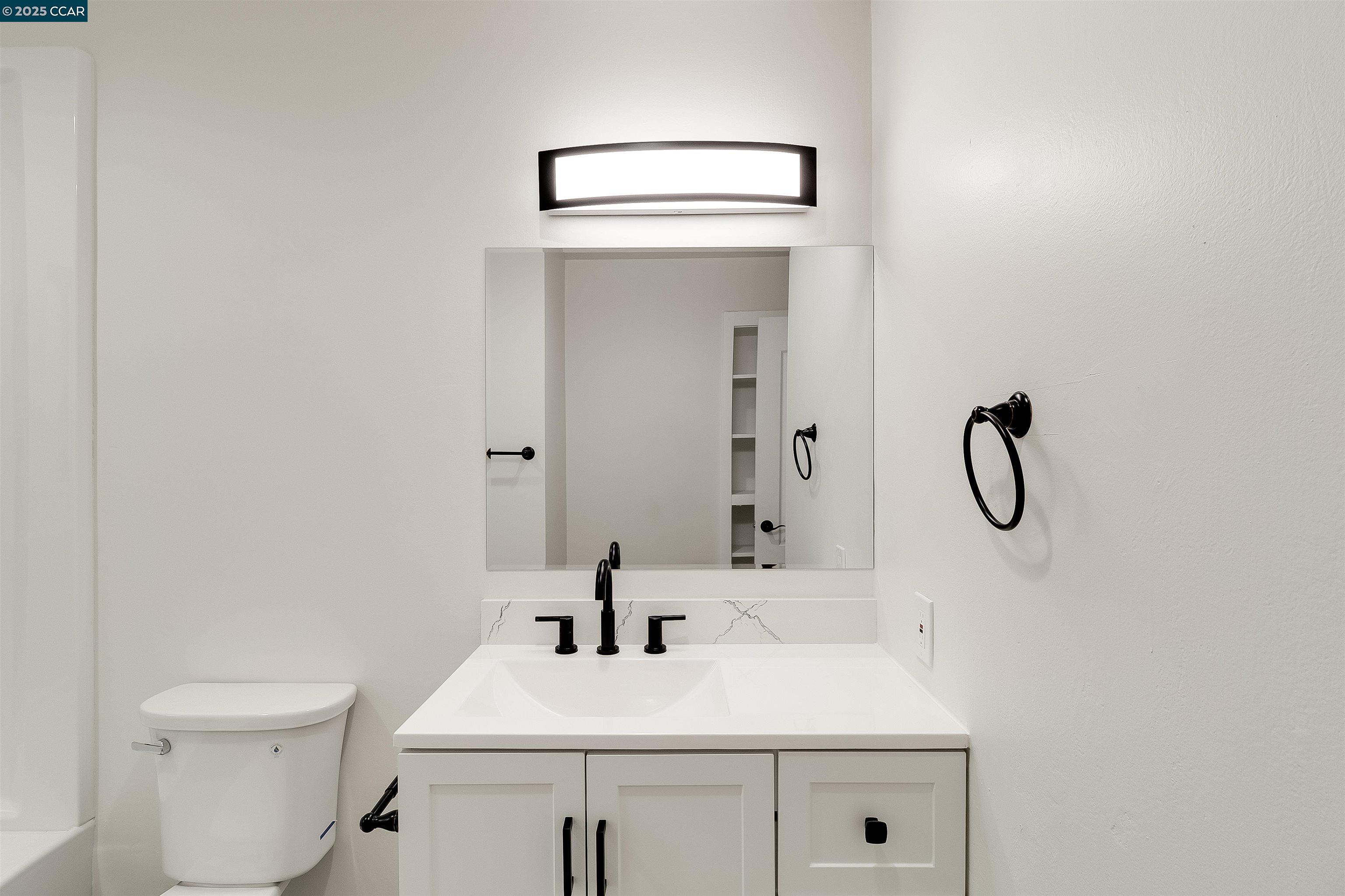 1863 San Clemente Street Fairfield, CA 94533 - Photo 19 of 29 a bathroom with a sink vanity and toilet