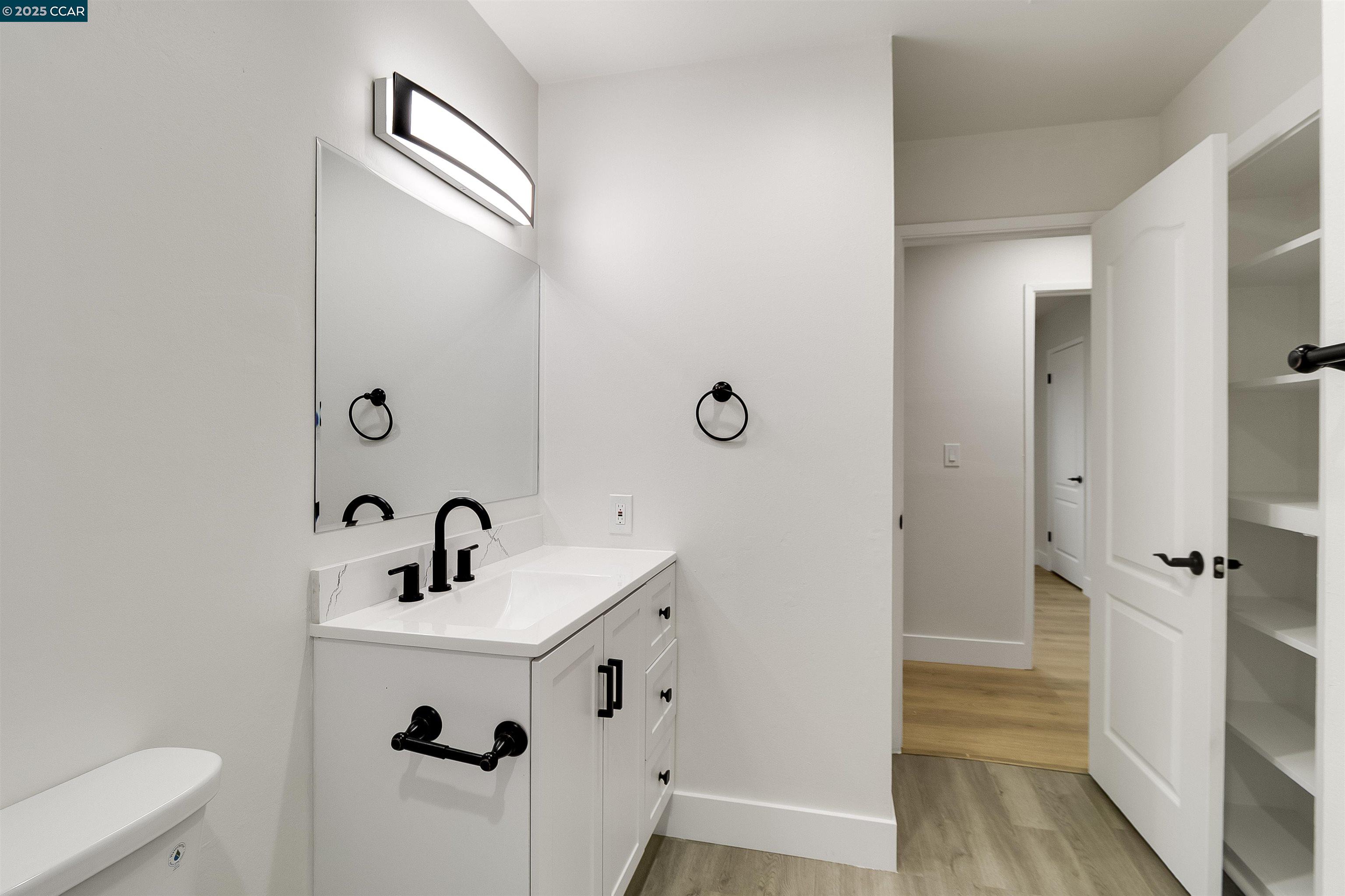 1863 San Clemente Street Fairfield, CA 94533 - Photo 21 of 29 a bathroom with a sink a mirror and shower