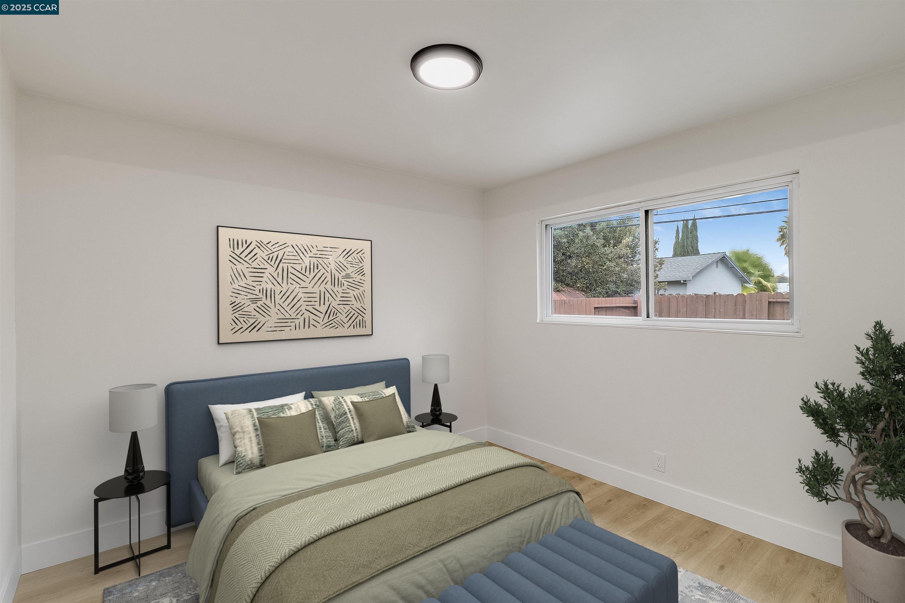1863 San Clemente Street Fairfield, CA 94533 - Photo 26 of 29 a bedroom with bed and a potted plant