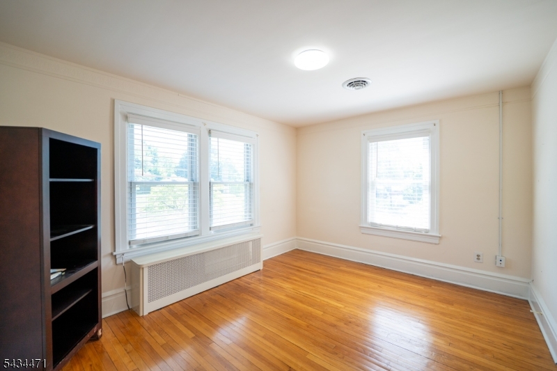 192 Lincoln Road Phillipsburg, NJ 08865 - Photo 32 of 50 a view of an empty room with a window and wooden floor
