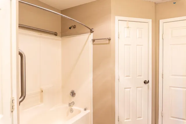 an empty room with closet area