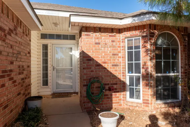 a view of a door with a potted plant