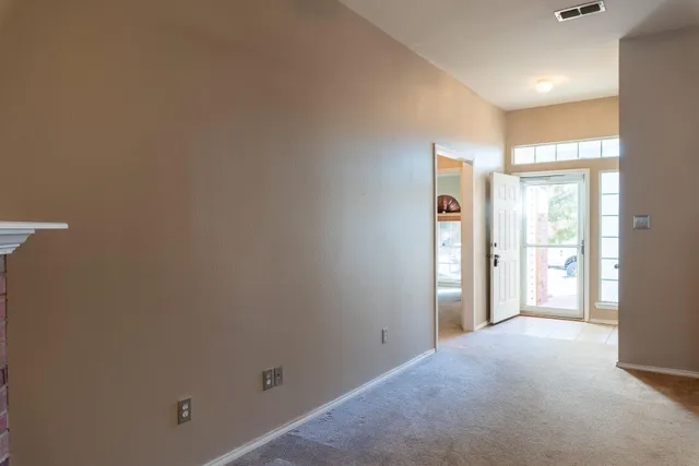 a kitchen with stainless steel appliances granite countertop a refrigerator and a stove