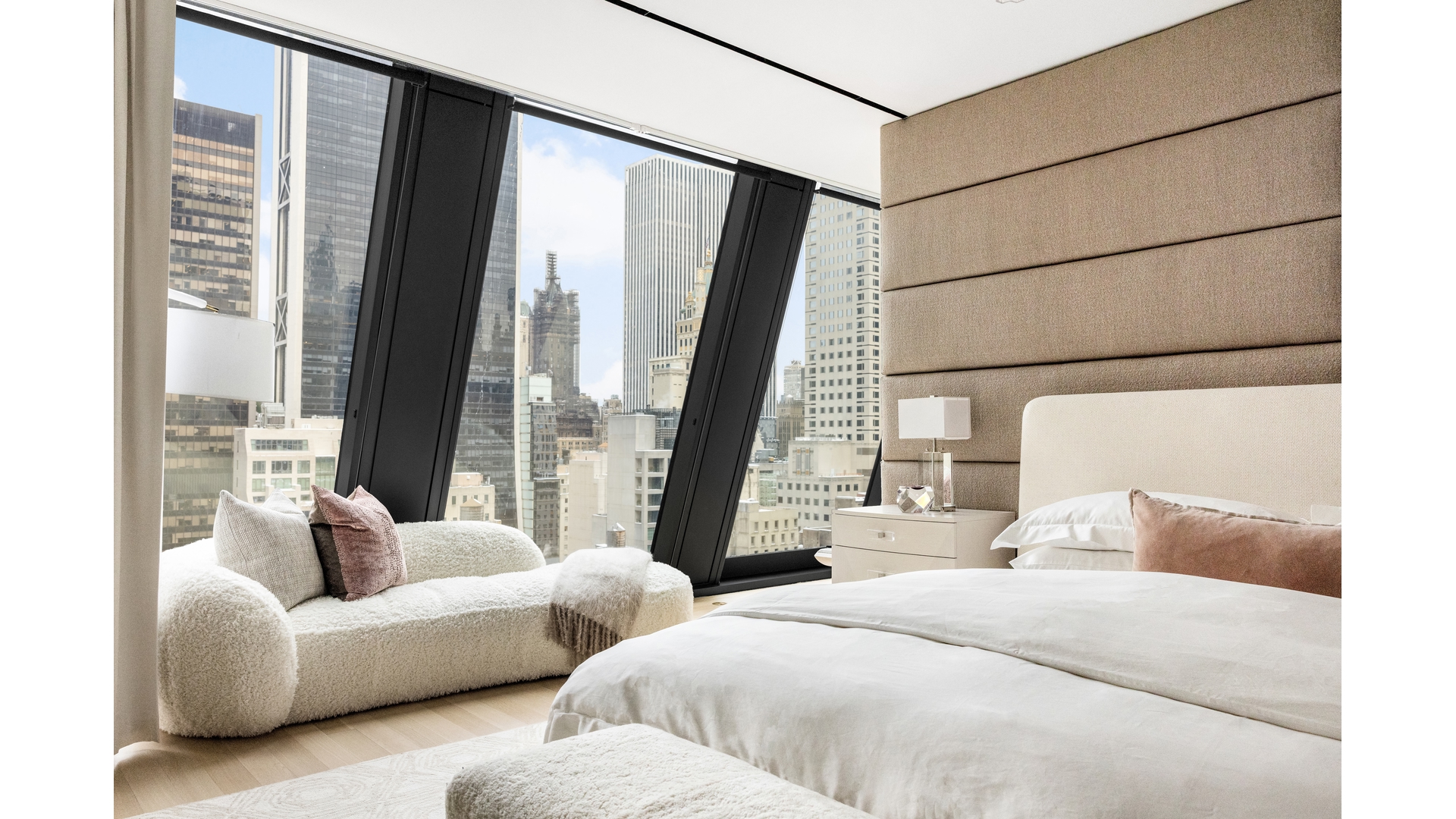 53 West 53rd Street, Unit 18B Manhattan, NY 10019 - Photo 11 of 17 a bedroom with two beds and large window