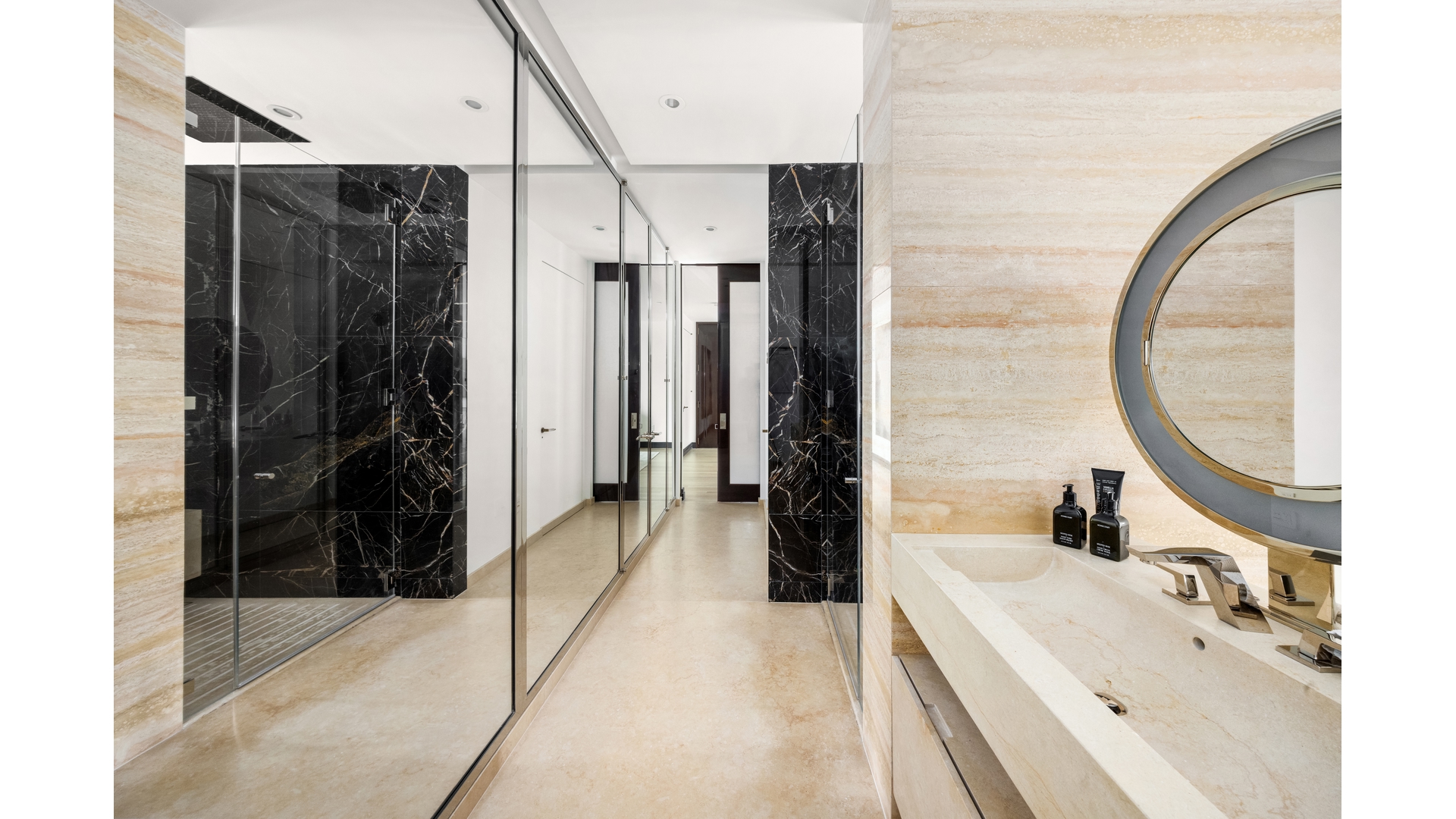 53 West 53rd Street, Unit 18B Manhattan, NY 10019 - Photo 12 of 17 a bathroom with a tub sink and mirror