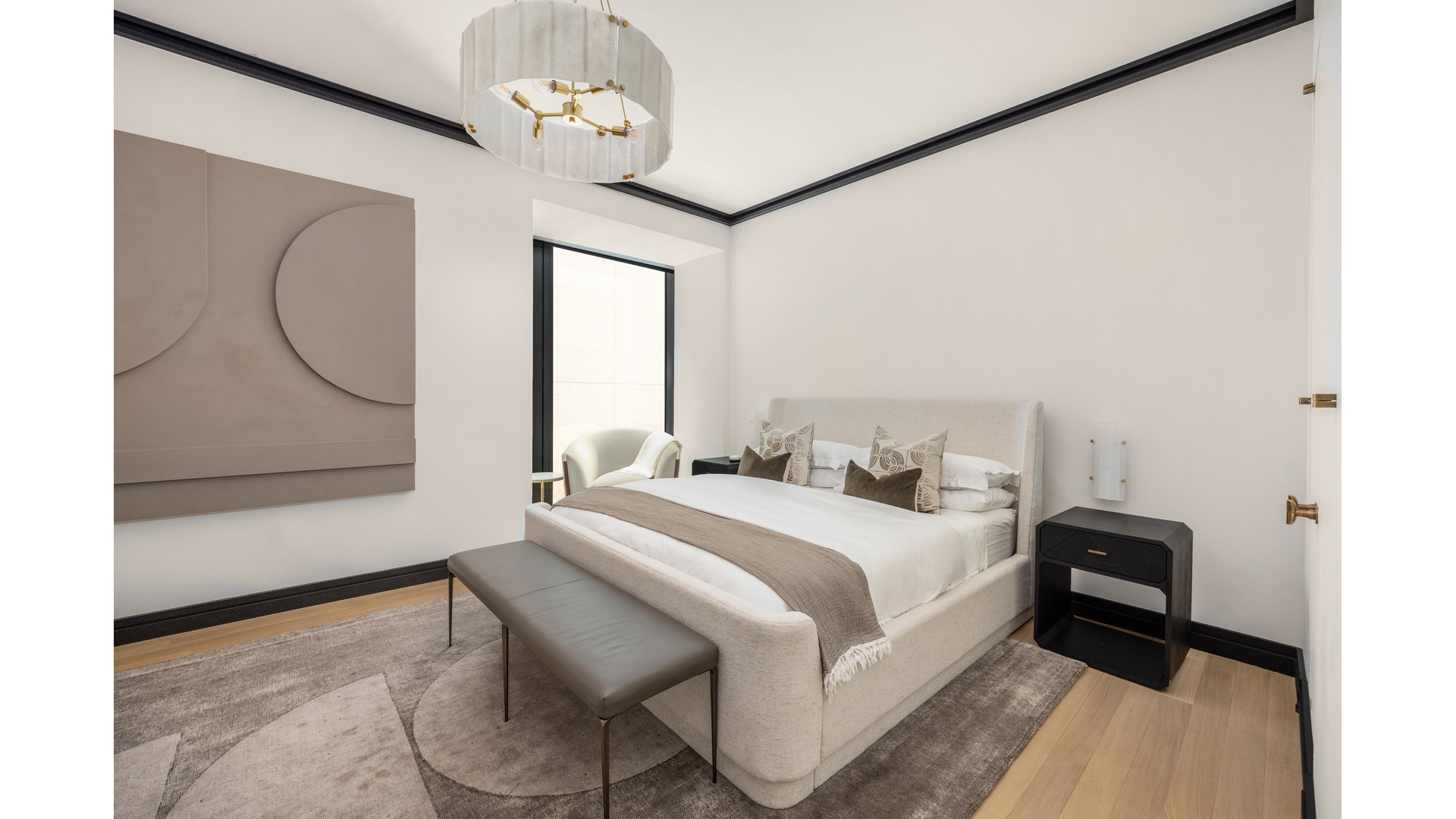 53 West 53rd Street, Unit 18B Manhattan, NY 10019 - Photo 14 of 17 a bedroom with a bed chandelier and a window
