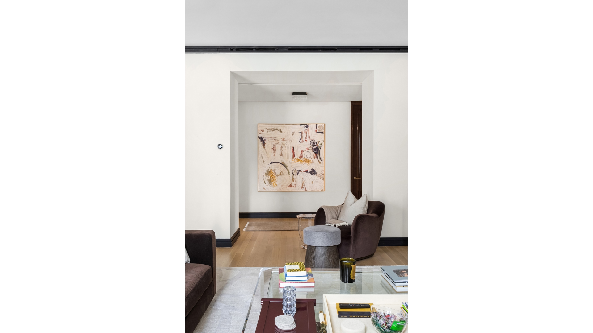 53 West 53rd Street, Unit 18B Manhattan, NY 10019 - Photo 16 of 17 a living room with furniture and a window
