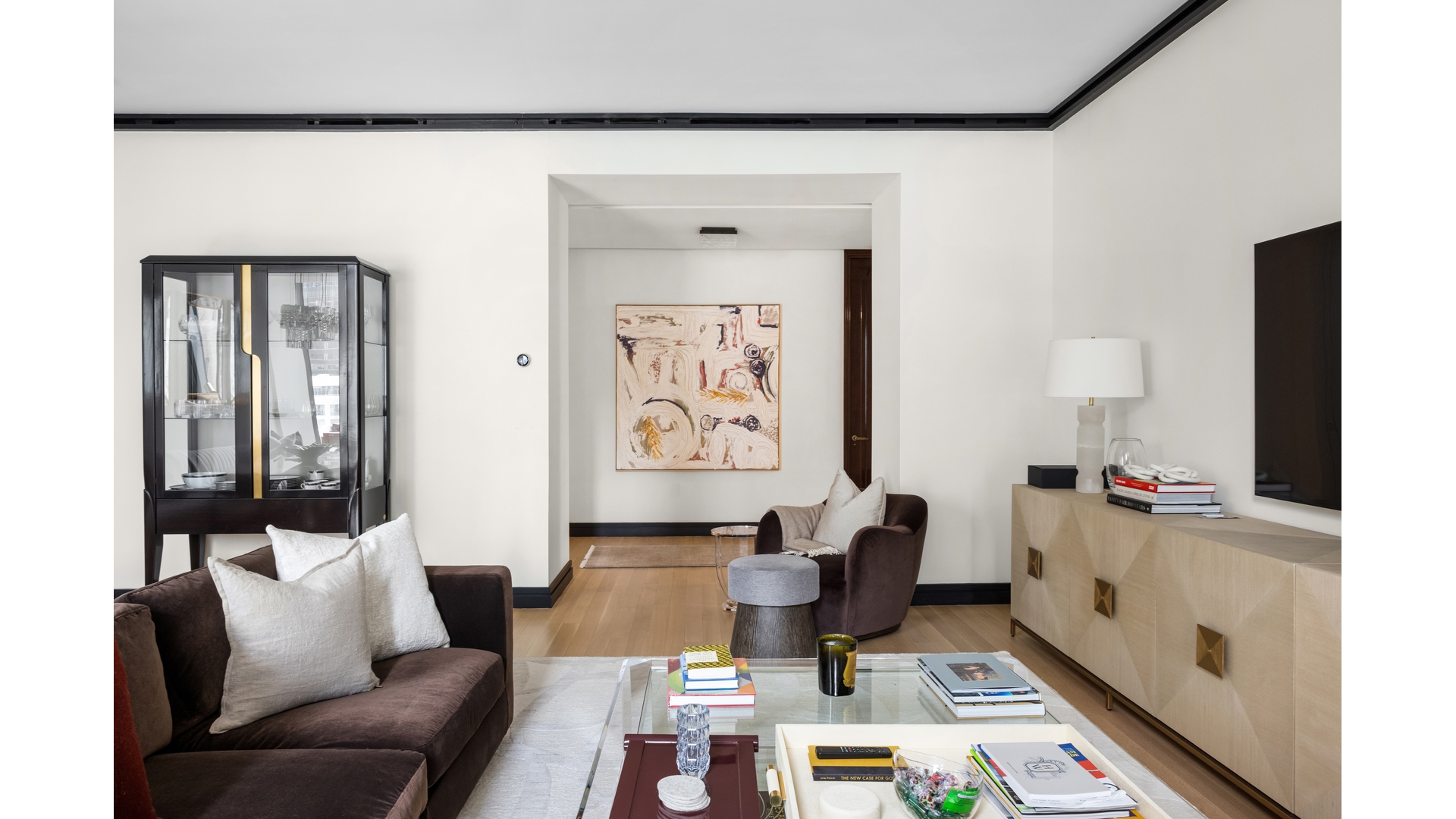 53 West 53rd Street, Unit 18B Manhattan, NY 10019 - Photo 2 of 17 a living room with furniture and a couch