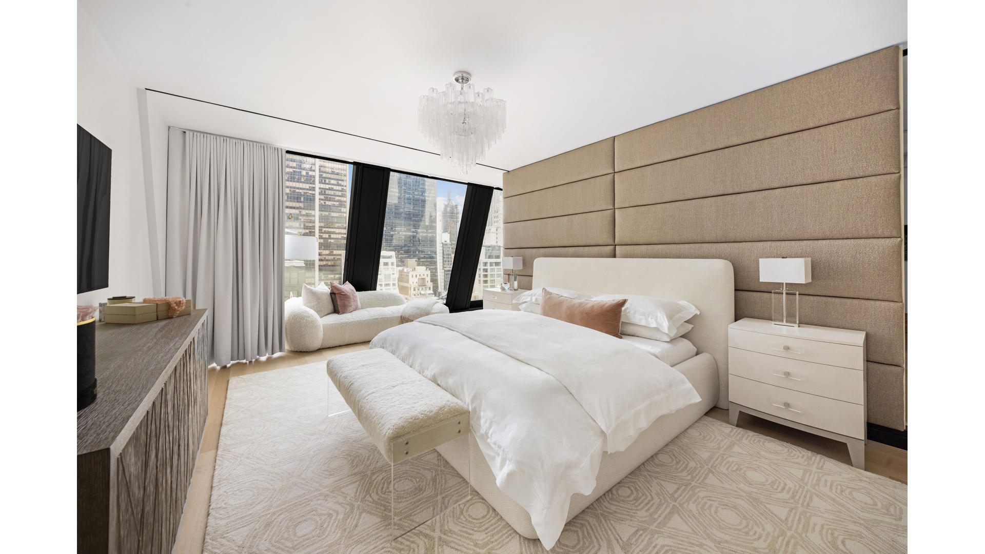53 West 53rd Street, Unit 18B Manhattan, NY 10019 - Photo 9 of 17 a bedroom with bed and large windows