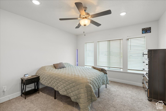 464 South Trejo Rdg Road Grantsville, UT 84029 - Photo 19 of 33 Bedroom featuring light carpet, baseboards, recessed lighting, and a ceiling fan