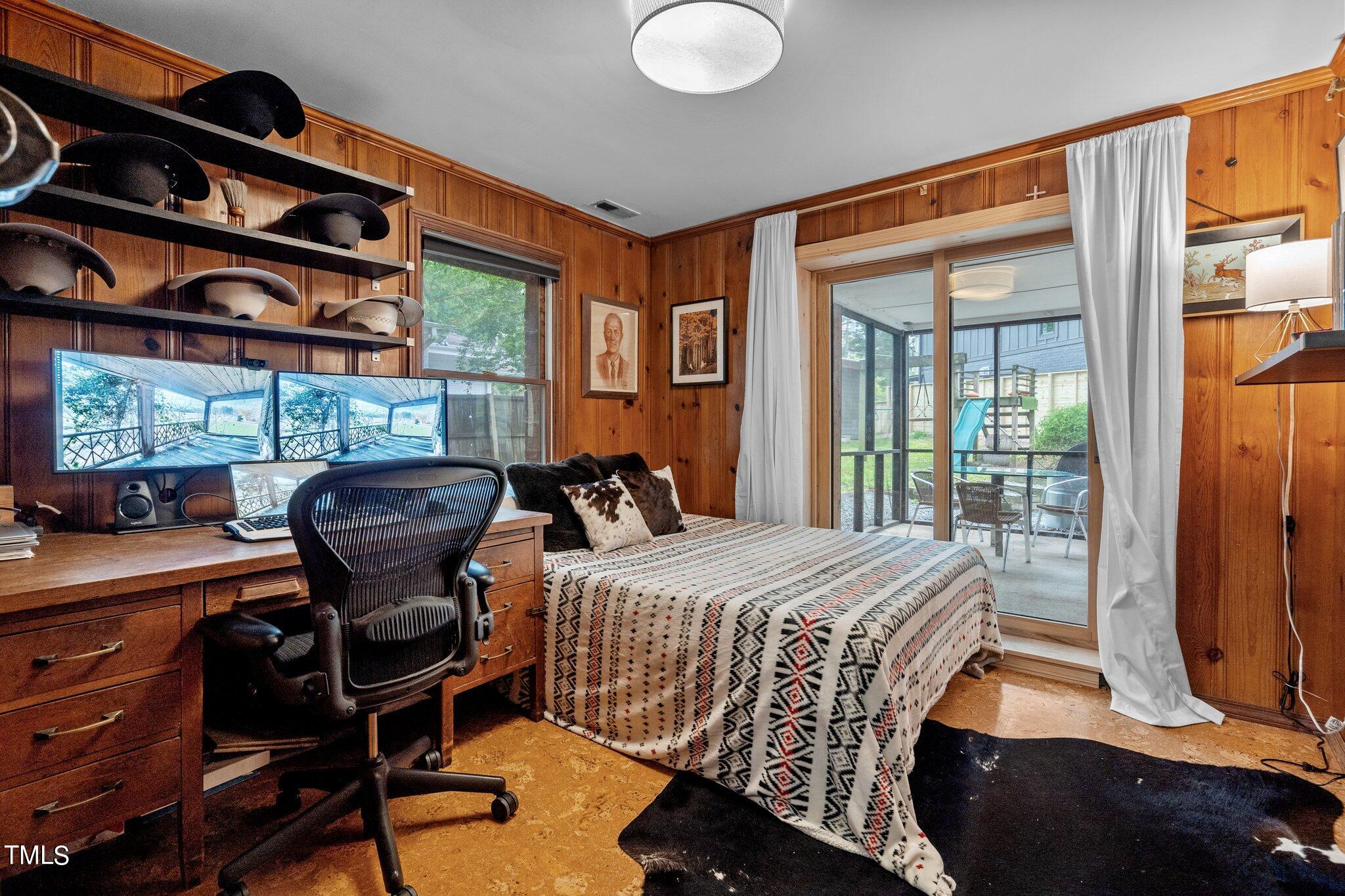 1330 Mordecai Drive Raleigh, NC 27604 - Photo 16 of 56 a bedroom with a bed and wooden floor