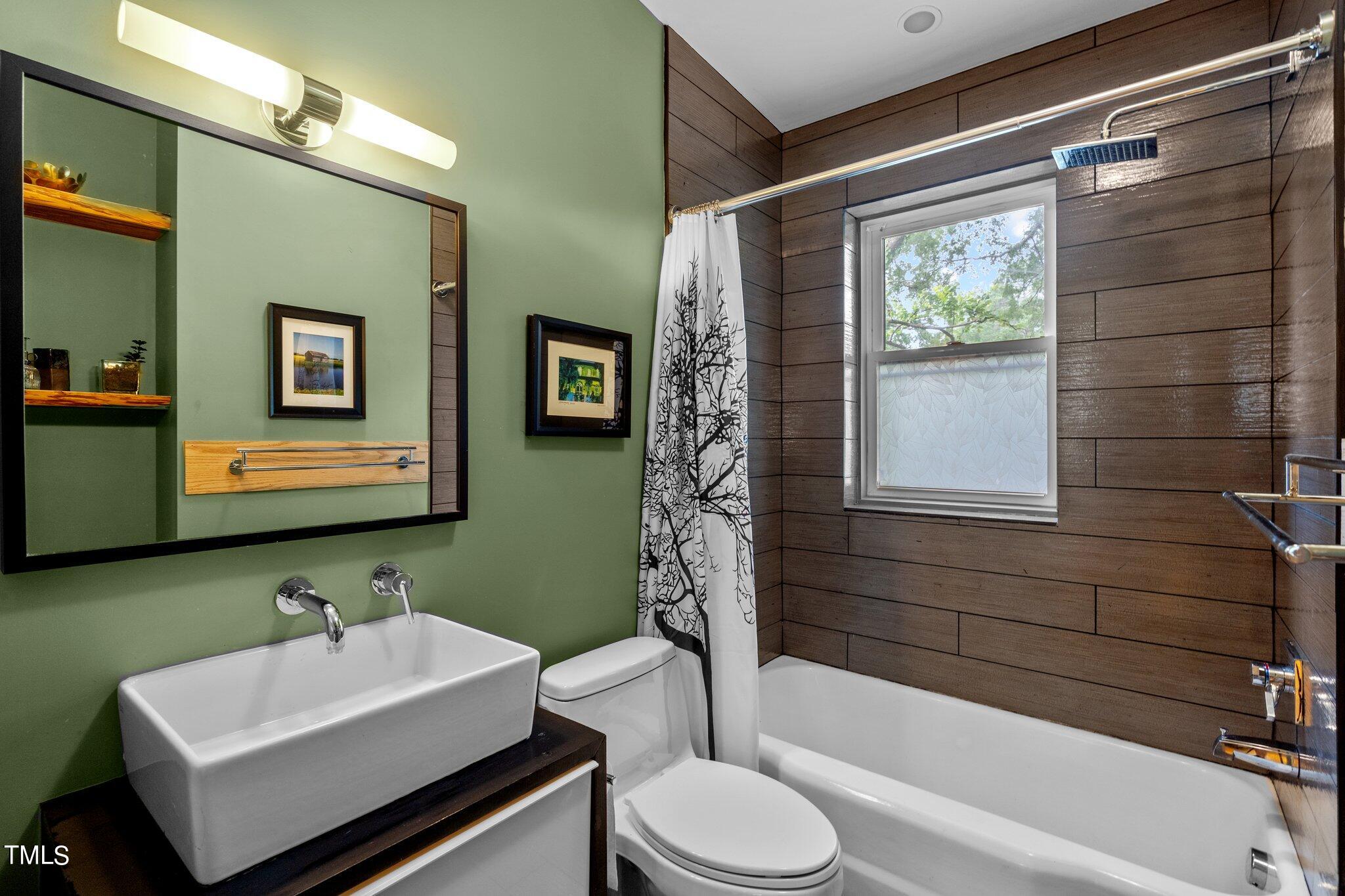 1330 Mordecai Drive Raleigh, NC 27604 - Photo 23 of 56 a bathroom with a sink toilet and shower