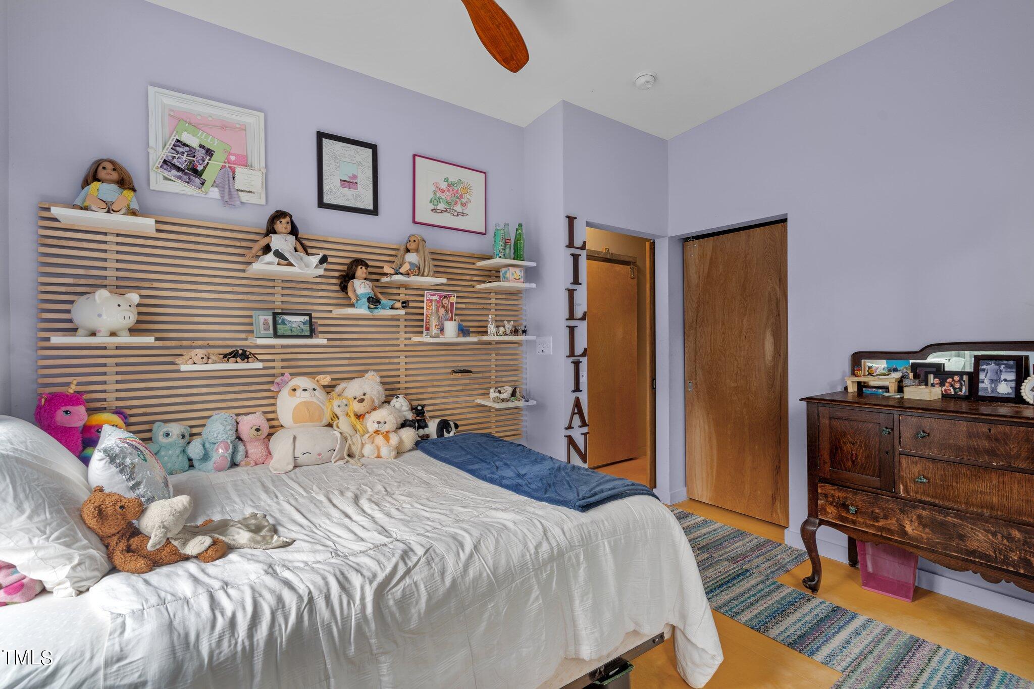 1330 Mordecai Drive Raleigh, NC 27604 - Photo 27 of 56 a bedroom with a bed and wooden floor