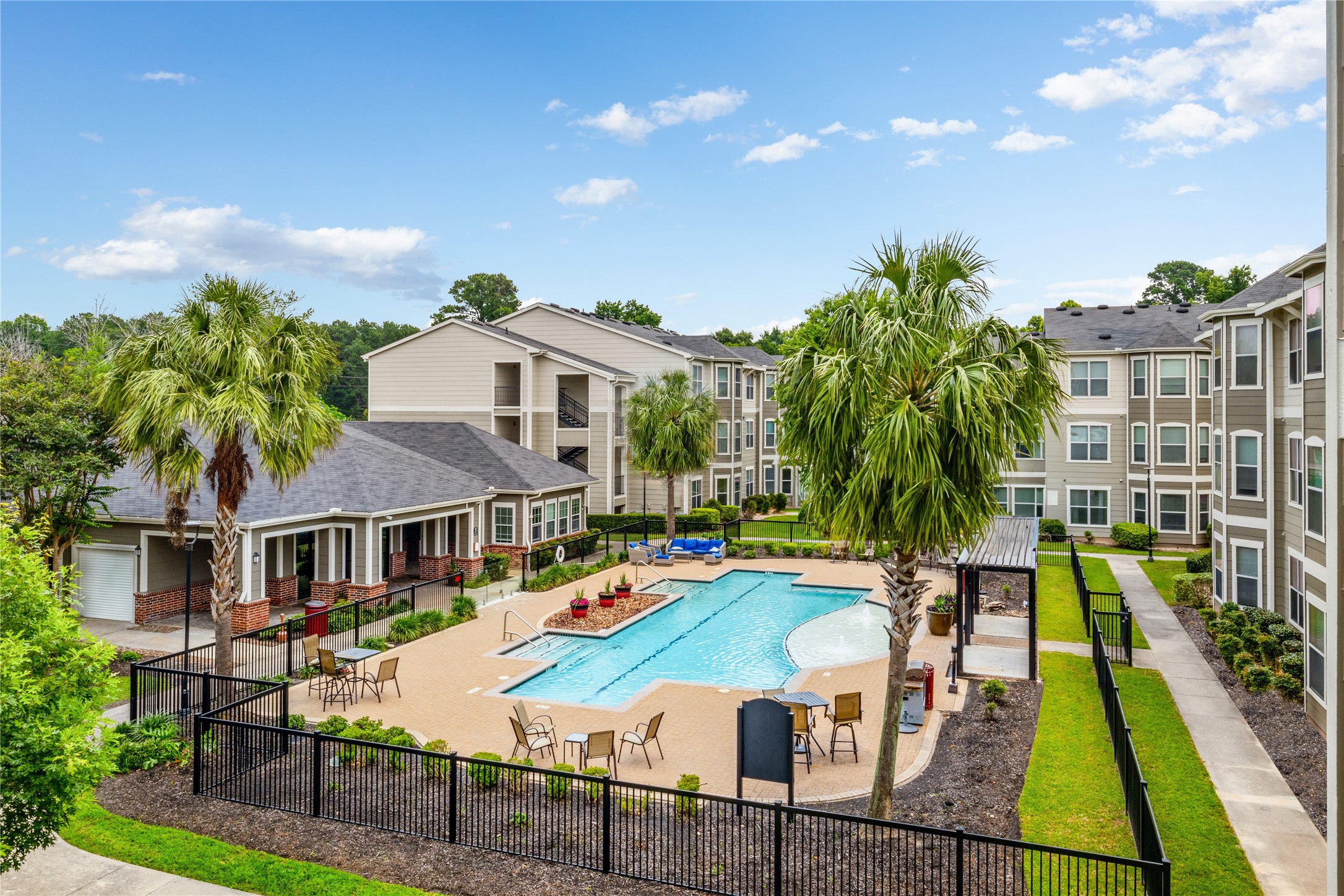 a view of house with swimming pool outdoor seating