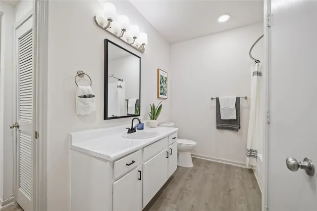 a spacious bathroom with a double vanity sink mirror and
