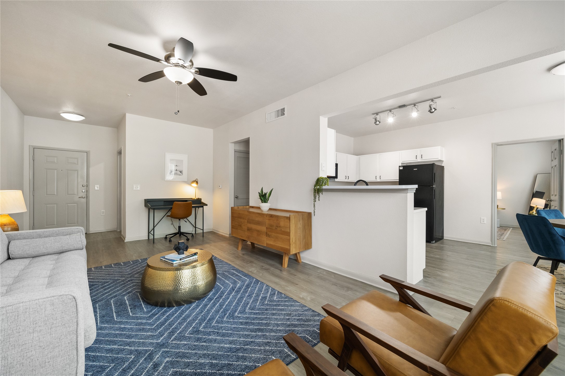 9494 Humble Westfield Road, Unit 3022 Humble, TX 77338 - Photo 9 of 22 a living room with furniture and wooden floor