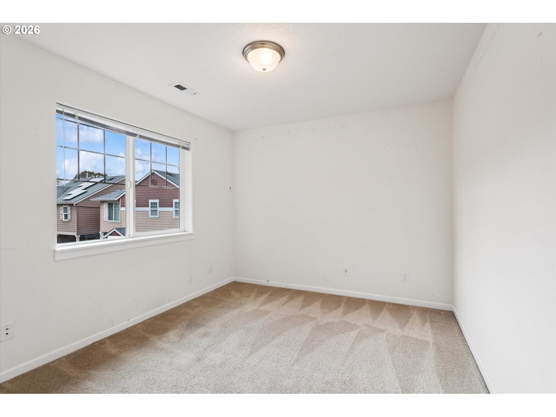 18232 Southwest Orlov Court Beaverton, OR 97078 - Photo 16 of 17 a view of an empty room with a window