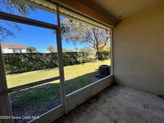 a view of a room with a large window
