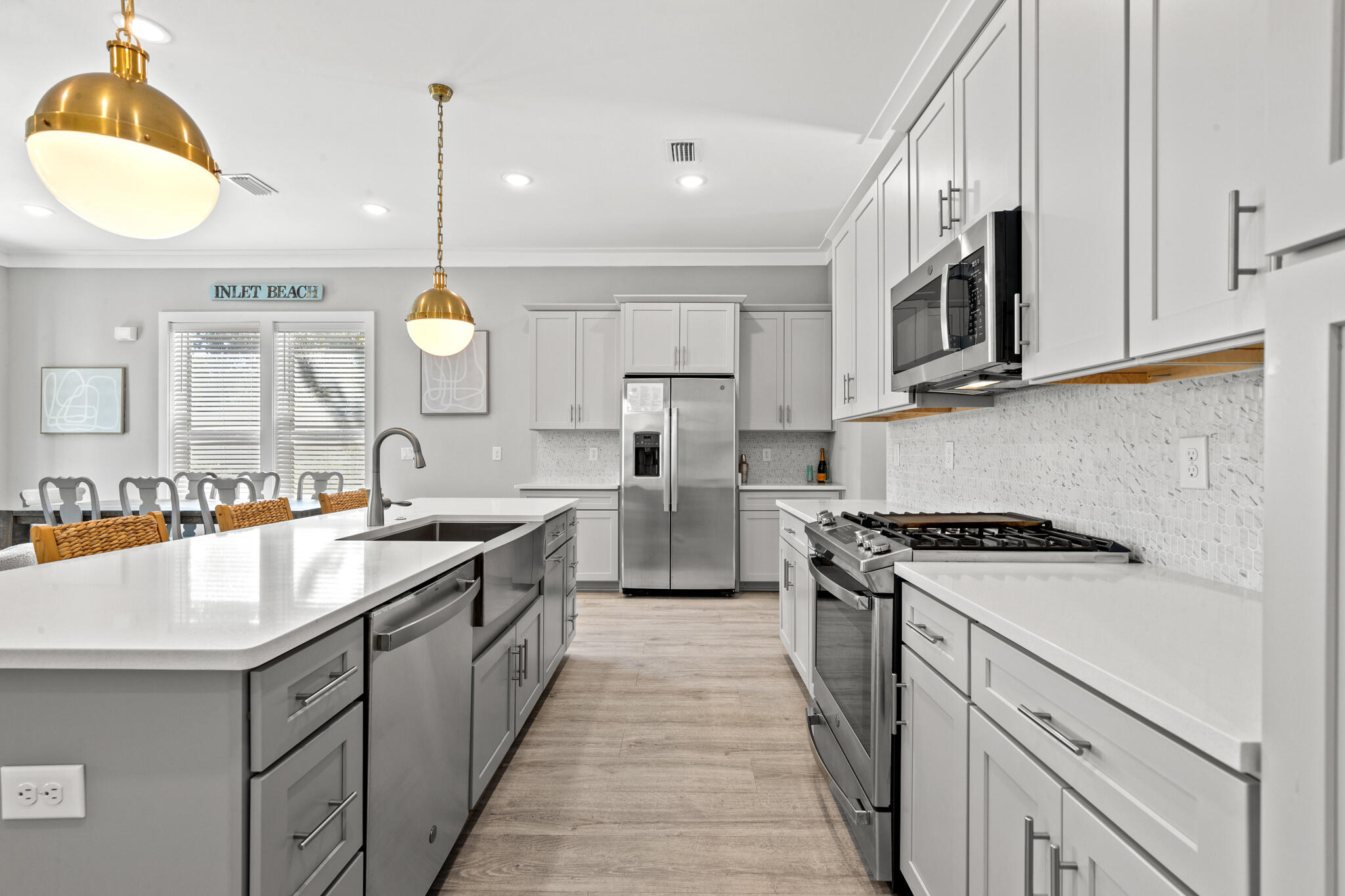 151 West Willow Mist Road Inlet Beach, FL 32461 - Photo 21 of 70 a kitchen with stainless steel appliances granite countertop a sink a stove and a wooden floors