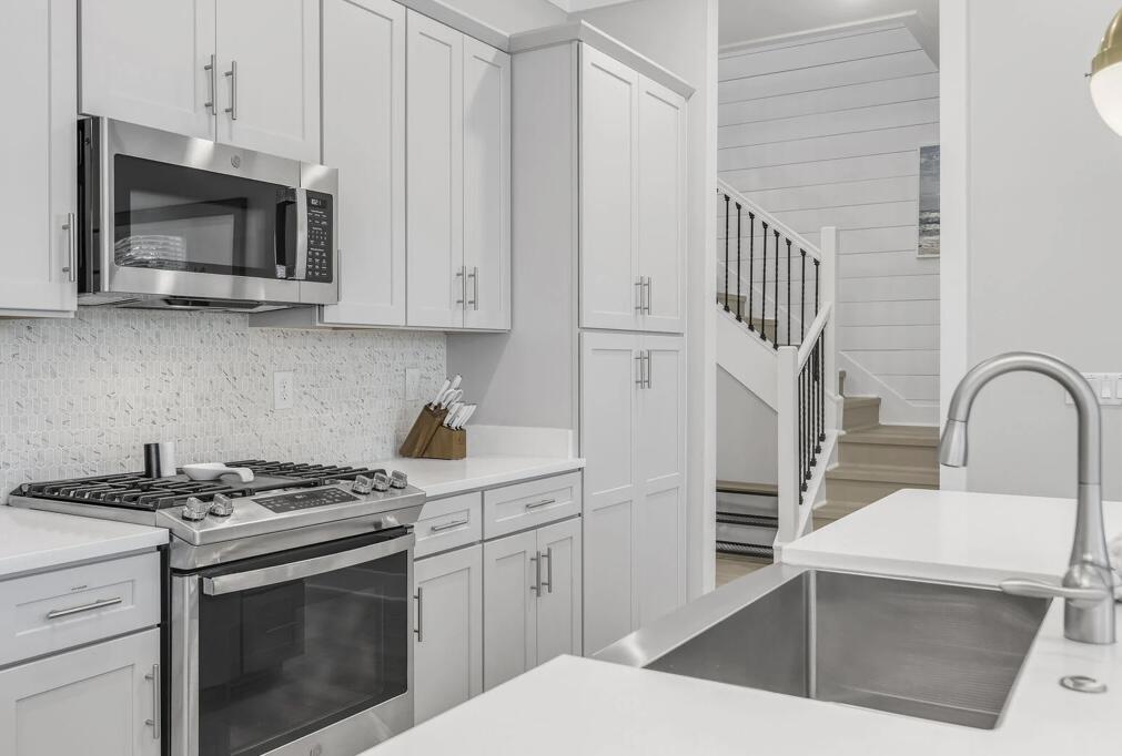 151 West Willow Mist Road Inlet Beach, FL 32461 - Photo 22 of 70 a kitchen with stainless steel appliances a stove microwave and cabinets