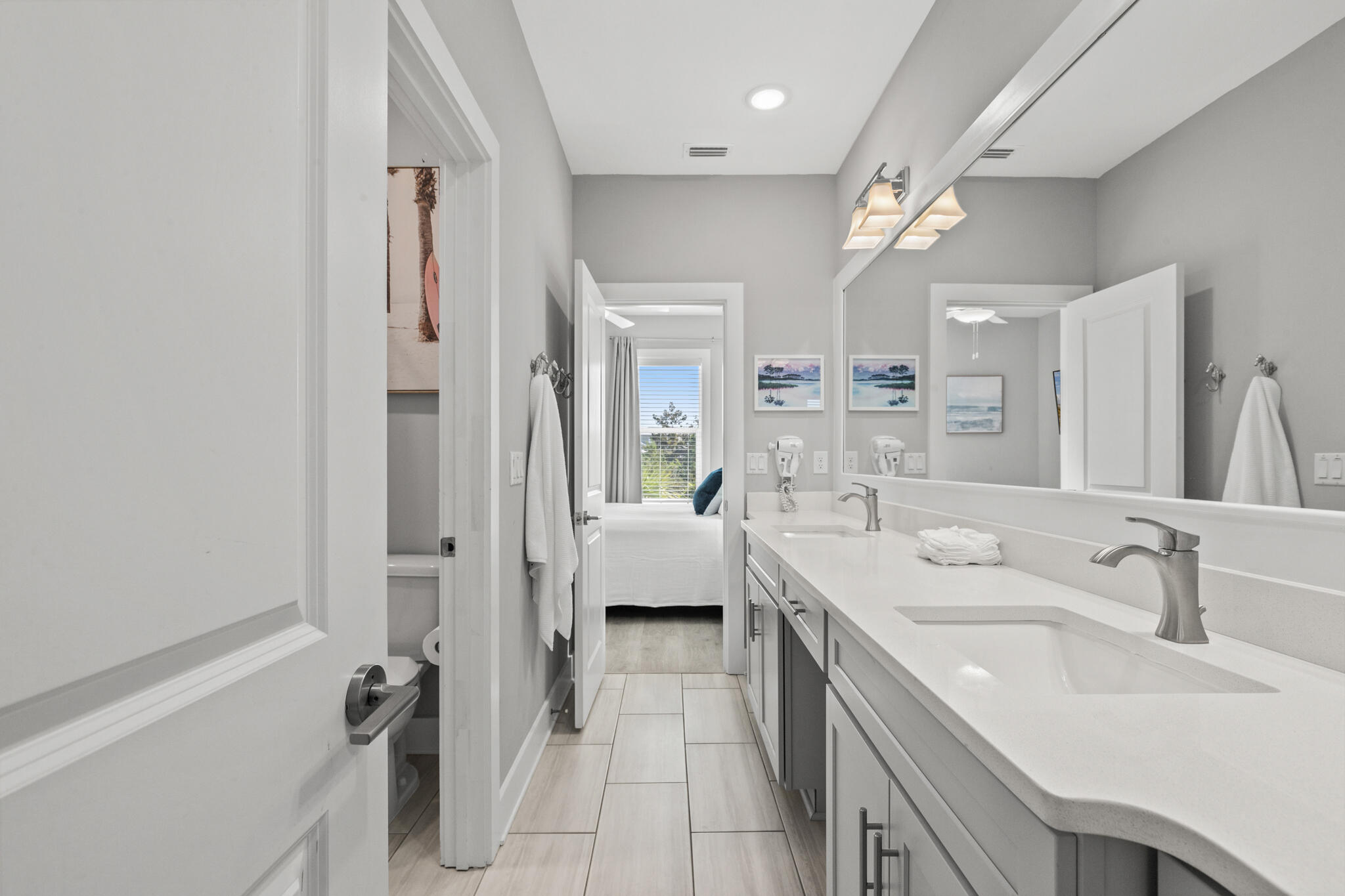 151 West Willow Mist Road Inlet Beach, FL 32461 - Photo 32 of 70 a spacious bathroom with a double vanity sink a mirror and a bathtub