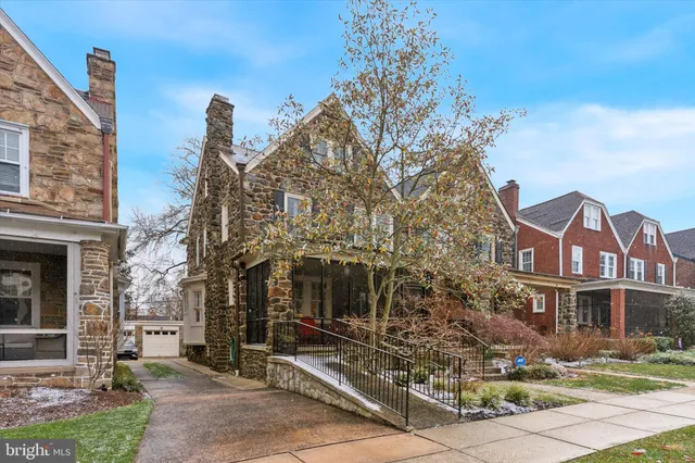 a front view of a building with garden