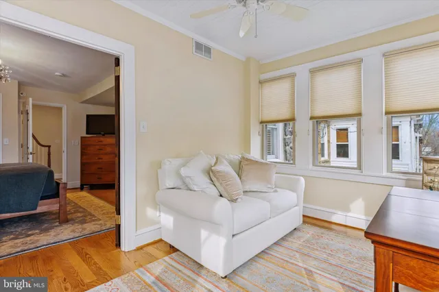 a spacious bathroom with a toilet sink and mirror