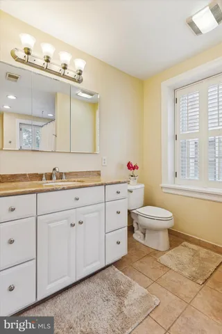 a view of room with window and cabinet