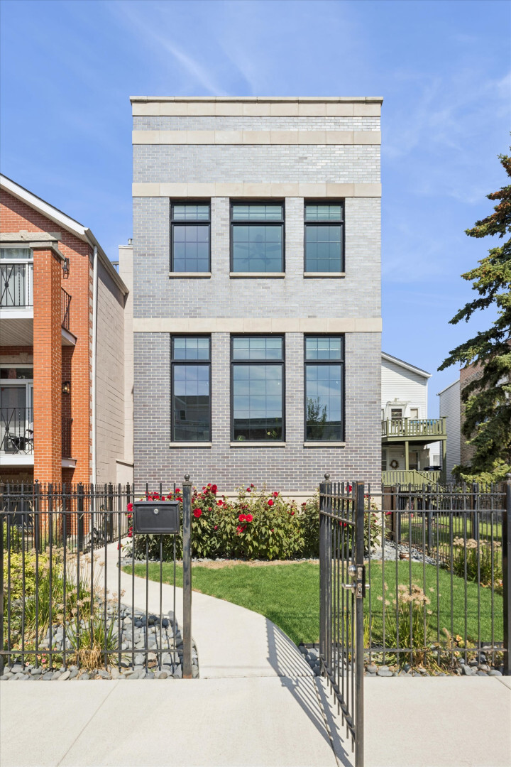 2154 West Erie Street Chicago, IL 60612 - Photo 1 of 1 a front view of a house with a yard