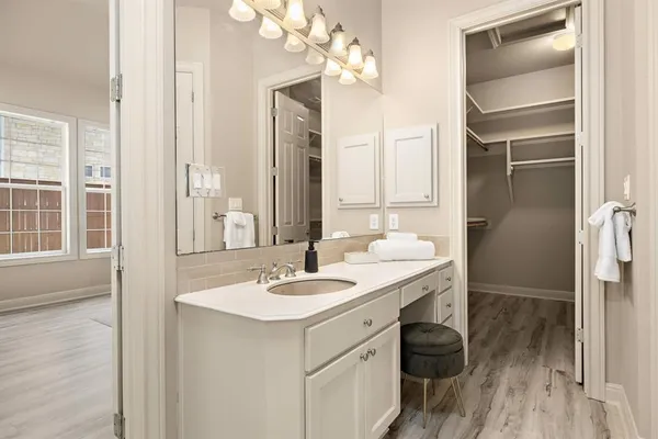 a bathroom with a sink double vanity and a mirror