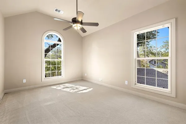 a view of an empty room with a window