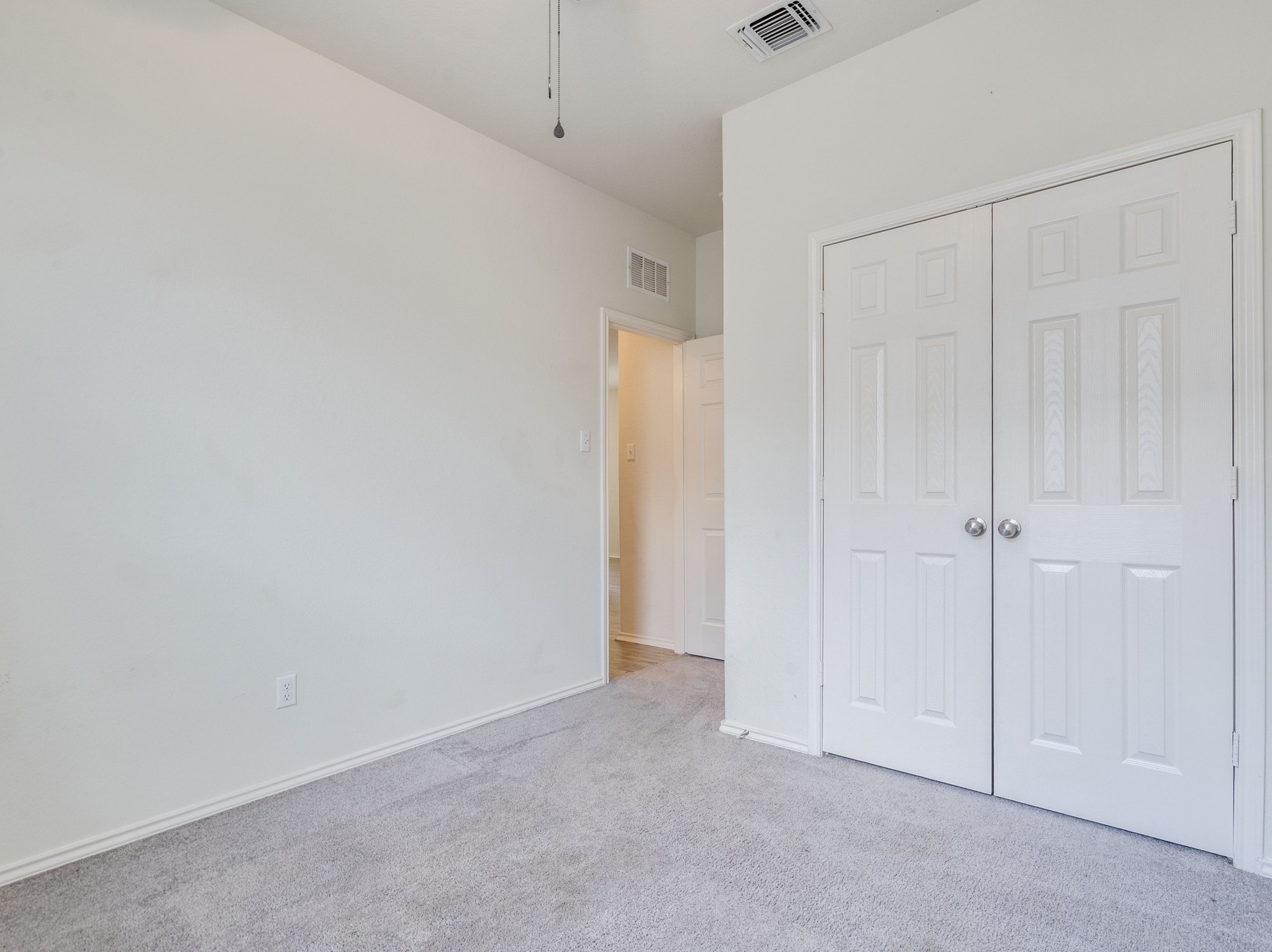 790 Pepperbark Loop Buda, TX 78610 - Photo 15 of 22 A well-maintained interior space with fresh paint and neutral tones, perfect for a personalized touch.