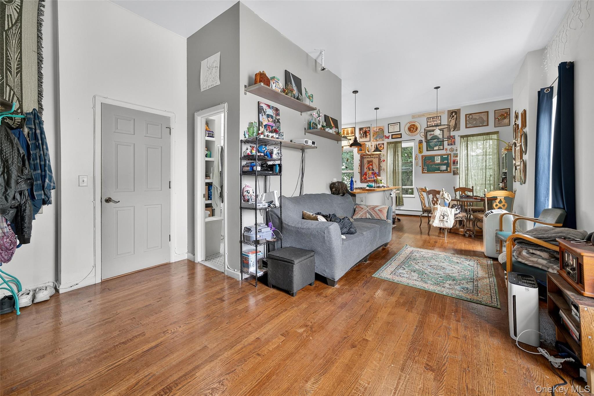 153 Lander Street Newburgh, NY 12550 - Photo 12 of 39 a living room with furniture and a flat screen tv