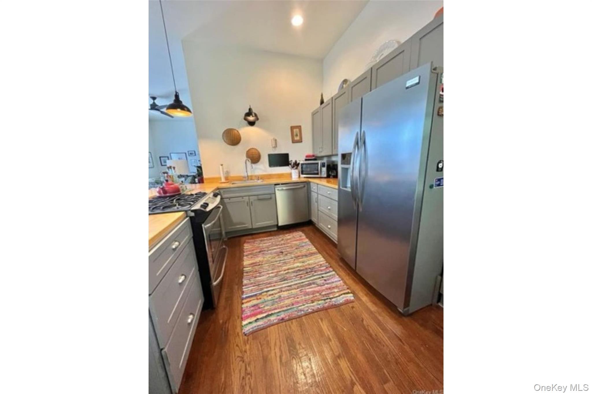 153 Lander Street Newburgh, NY 12550 - Photo 15 of 39 a kitchen with a sink and refrigerator