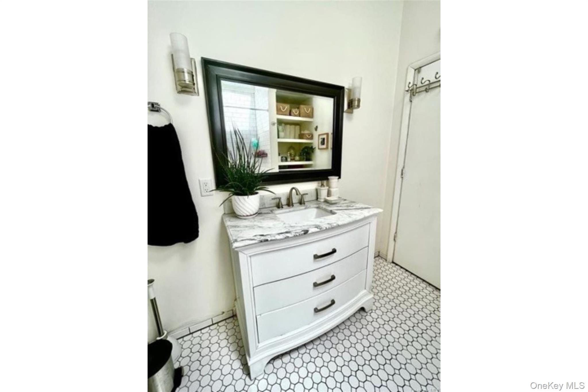 153 Lander Street Newburgh, NY 12550 - Photo 18 of 39 a bathroom with a sink a mirror and vanity
