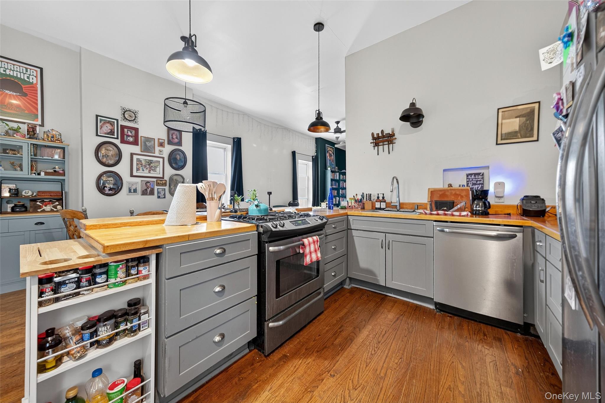 153 Lander Street Newburgh, NY 12550 - Photo 2 of 39 a kitchen with stainless steel appliances granite countertop a stove a sink and a refrigerator